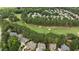Scenic aerial view of a community with homes surrounding a well-manicured golf course at 763 Heritage Arbor Dr, Wake Forest, NC 27587