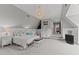 Charming bedroom with a decorative chandelier, neutral colors, and ample space at 763 Heritage Arbor Dr, Wake Forest, NC 27587