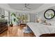 A spacious bedroom features hardwood floors, tray ceilings, and plentiful natural light at 763 Heritage Arbor Dr, Wake Forest, NC 27587