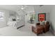 Serene bedroom with a seating area, desk, and plenty of natural light at 763 Heritage Arbor Dr, Wake Forest, NC 27587