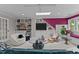 Bonus room featuring built-in shelves, accent wall, and stylish furnishings at 763 Heritage Arbor Dr, Wake Forest, NC 27587