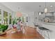 Inviting breakfast nook with bright light, a decorative light fixture, and hardwood floors at 763 Heritage Arbor Dr, Wake Forest, NC 27587