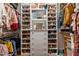 Walk-in closet with custom shelving units, drawers, and shoe storage at 763 Heritage Arbor Dr, Wake Forest, NC 27587