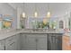 Bright kitchen with white cabinets, stainless steel appliances, and marble countertops at 763 Heritage Arbor Dr, Wake Forest, NC 27587