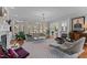 A stylish living room features hardwood floors, a fireplace, and a modern area rug at 763 Heritage Arbor Dr, Wake Forest, NC 27587
