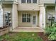 View of the back patio surrounded by grass and trees at 7646 Winners Edge St, Raleigh, NC 27617