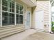 View of the back patio with windows and doors at 7646 Winners Edge St, Raleigh, NC 27617