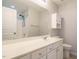 Bright bathroom with white vanity, cabinet, shower and large mirror at 7646 Winners Edge St, Raleigh, NC 27617