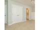 A bedroom with carpet, double closets, and a view into the bathroom at 7646 Winners Edge St, Raleigh, NC 27617