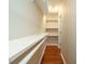 Walk in closet with installed shelving at 7646 Winners Edge St, Raleigh, NC 27617