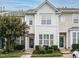 Charming townhome featuring a well-maintained facade, lush landscaping, and inviting curb appeal at 7646 Winners Edge St, Raleigh, NC 27617