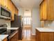 Efficient kitchen space featuring wooden cabinetry, stainless steel appliances, and open layout at 7646 Winners Edge St, Raleigh, NC 27617
