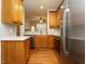 Well-appointed kitchen with stainless steel appliances, wooden cabinets and white countertops at 7646 Winners Edge St, Raleigh, NC 27617