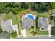 Aerial view of a home featuring an inground pool and a meticulously manicured lawn at 825 Highwater Pl, Fuquay Varina, NC 27526