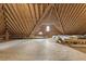 Finished attic features exposed rafters, wood flooring, and arched windows at 825 Highwater Pl, Fuquay Varina, NC 27526