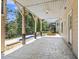Relaxing outdoor patio featuring stamped concrete, a pool, and wooded views at 825 Highwater Pl, Fuquay Varina, NC 27526