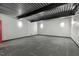Spacious basement with gray carpet and exposed ceiling; ideal for storage or finishing at 825 Highwater Pl, Fuquay Varina, NC 27526