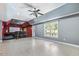 Finished basement with tile flooring featuring a theater room and outside access at 825 Highwater Pl, Fuquay Varina, NC 27526