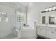 Bathroom featuring a glass shower, soaking tub, and marble-like tile at 825 Highwater Pl, Fuquay Varina, NC 27526