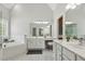 Bathroom featuring a glass shower, soaking tub, and marble-like tile and double vanity at 825 Highwater Pl, Fuquay Varina, NC 27526