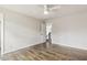 Bedroom boasting hardwood floors, ceiling fan and view to the staircase at 825 Highwater Pl, Fuquay Varina, NC 27526