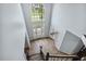 Bright foyer with high ceiling, large window, and decorative chandelier, offering a grand entrance at 825 Highwater Pl, Fuquay Varina, NC 27526