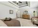 Bright main bedroom boasts a tray ceiling, area rug, dresser, and seating area at 825 Highwater Pl, Fuquay Varina, NC 27526