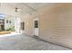 Covered outdoor patio with stamped concrete, a fan, and access door to the home at 825 Highwater Pl, Fuquay Varina, NC 27526