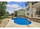 Gorgeous pool area offers a relaxing retreat, complete with a hot tub and privacy fence at 825 Highwater Pl, Fuquay Varina, NC 27526