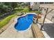 Sparkling in-ground pool area featuring landscaped surroundings, a hot tub, and a sunning deck at 825 Highwater Pl, Fuquay Varina, NC 27526