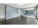 Home recreation room featuring rubber flooring, large mirrors, and grey walls at 825 Highwater Pl, Fuquay Varina, NC 27526