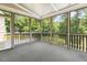 Lovely screened-in porch with views of the surrounding greenery and nature at 825 Highwater Pl, Fuquay Varina, NC 27526