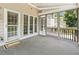 Inviting screened porch with neutral colors, ample natural light, and multiple doors at 825 Highwater Pl, Fuquay Varina, NC 27526