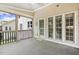 Charming screened porch featuring cozy decor, neighborhood views, and lots of windows at 825 Highwater Pl, Fuquay Varina, NC 27526