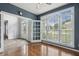 Light-filled sunroom with hardwood floors and multiple windows, perfect for relaxing or entertaining at 825 Highwater Pl, Fuquay Varina, NC 27526