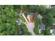 Aerial view of a home in a lush, green, tree-filled neighborhood showing property lines at 9020 Branch Creek Way, Apex, NC 27539