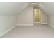 Attic area featuring carpet and window at 9020 Branch Creek Way, Apex, NC 27539