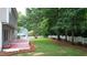 A spacious backyard features a deck and a white picket fence, perfect for outdoor entertaining and relaxation at 9020 Branch Creek Way, Apex, NC 27539