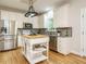 Beautiful kitchen featuring stainless steel appliances, a kitchen island, and granite countertops at 9020 Branch Creek Way, Apex, NC 27539