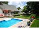 Backyard pool and patio area with outdoor dining, perfect for entertaining at 907 Stuart Dr, Mebane, NC 27302