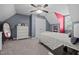 Cozy bedroom with sloped ceiling, carpet and a white bed frame at 907 Stuart Dr, Mebane, NC 27302