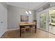 Cozy dining room with stylish lighting and access to the back porch at 907 Stuart Dr, Mebane, NC 27302