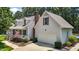 Beautiful home exterior with a well-manicured lawn and two car garage at 907 Stuart Dr, Mebane, NC 27302