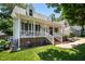 Beautiful home with inviting porch and well-maintained landscaping at 907 Stuart Dr, Mebane, NC 27302