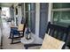 Inviting front porch with rocking chairs, side table and decor for relaxing outdoors at 907 Stuart Dr, Mebane, NC 27302