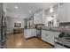 Bright kitchen with stainless steel appliances and breakfast area with dining table at 907 Stuart Dr, Mebane, NC 27302