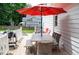 Outdoor dining area featuring seating around a table with an umbrella at 907 Stuart Dr, Mebane, NC 27302