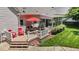 Outdoor dining area and seating with a built in grill under a shade umbrella at 907 Stuart Dr, Mebane, NC 27302
