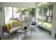 Cozy sunroom with comfortable seating and lots of natural light at 907 Stuart Dr, Mebane, NC 27302