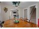 Elegant dining room displaying a wood table with archway leading to the living room and staircase at 9964 N Chestnut St, Middlesex, NC 27557